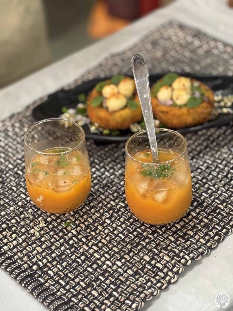 A close-up of Crispy Nest Potato Chaat and savory Sattu Summer Drink showcasing mindful plating and textured fusion ingredients.