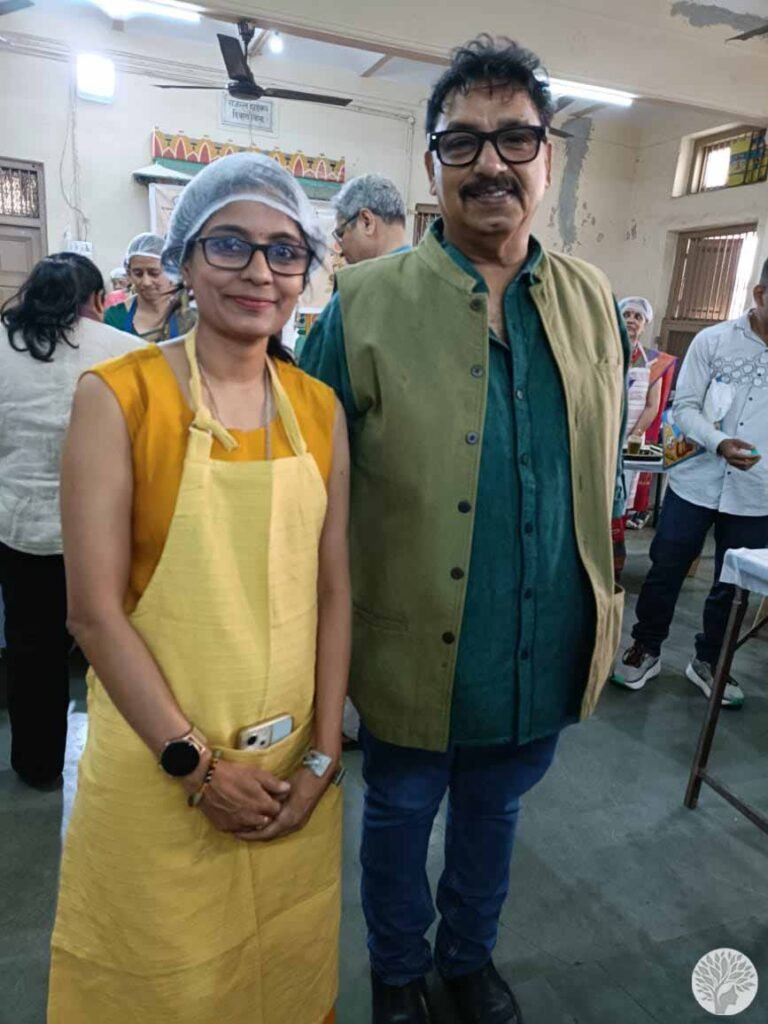 Hetal Patil at stall number five discussing the principles of mindful cooking at home with celebrity Chef Vishnu Manohar during a Baroda culinary contest.